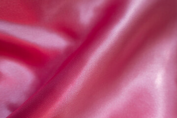 Barbie pink satin polyester fabric in soft folds