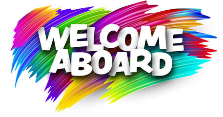 Welcome aboard paper word sign with colorful spectrum paint brush strokes over white.