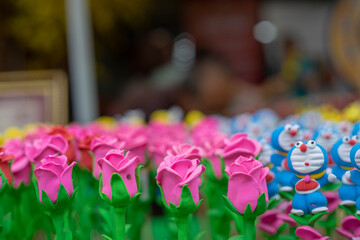Everything standing in traditional clothing.
fences surrounded by pink wildflowers.Religion uses...