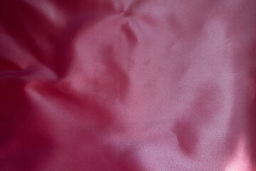 Surface of cold pink satin polyester fabric
