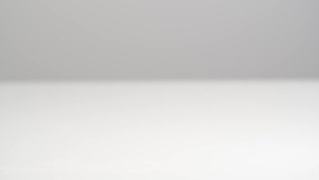 A woman's hand takes a glass with a dissolved effervescent pill. Effervescent vitamin C tablets