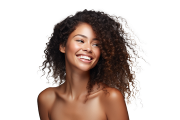 Joyful woman with curly hair and a captivating smile on a dark background