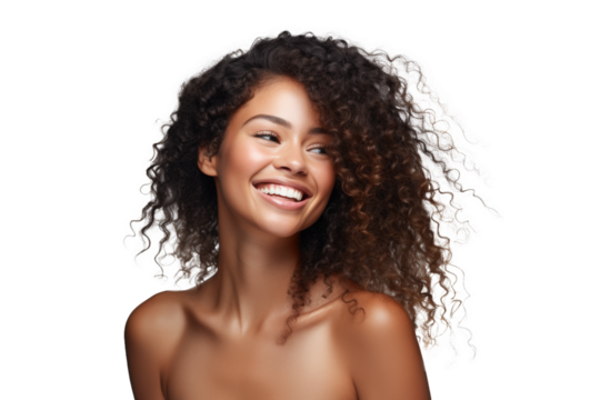 Joyful woman with curly hair and a captivating smile on a dark background