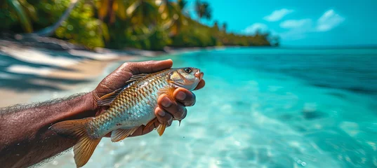 Foto op Plexiglas A man fishes on the tropical beach background, tropical activity © Kateryna Kordubailo