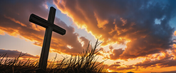 Wooden cross with sunset clouds