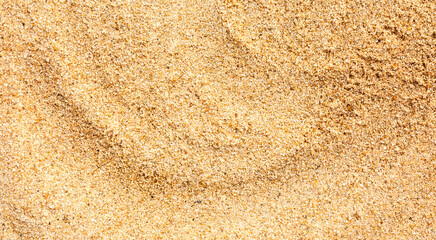 Fototapeta na wymiar Bright Golden Sand Texture Background with copy space.