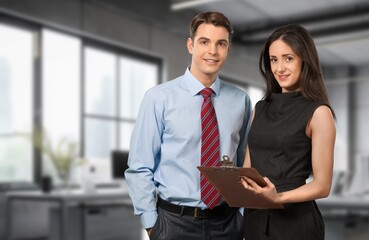 Group of business people works in corporate office.