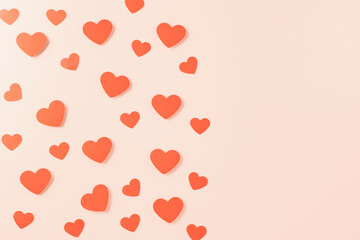 Happy Valentine's day concept. Symbol of love paper art with copy space for text, handmade red paper hearts shape cutting pastel pink background, Mother's Day