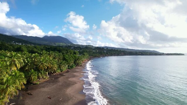 Plage de Grande Anse, pristine beach in Guadeloupe, French Antilles. Aerial forward 