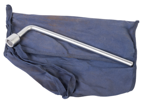 Wheel wrench and transportation hook on a blue cover for car repair on the road in the absence of insurance on a white isolated background.