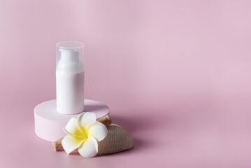 Natural skincare product branding mock up Blank white squeeze bottle plastic tube on circle podium with flower Packaging of cream or serum Beauty cosmetic concept Copy Space