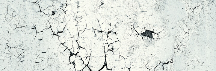 Peeling paint on the wall. Panorama of a concrete wall with old cracked flaking paint. Weathered...