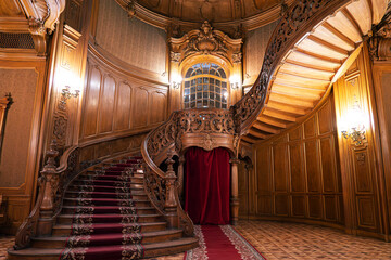 Entrance hall with vintage spiral staircase House of Scientists , Lviv , Ukraine , western Ukraine,...