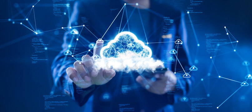 Cloud or edge computing technology concept. Businessman uses finger to click cloud icon connects data access Global use abstract binary code on dark blue background. - Powered by Adobe