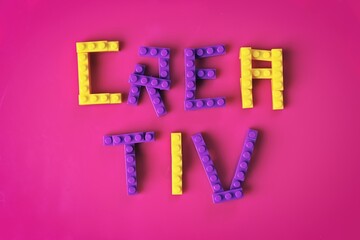 Lettering Creative built with toy blocks. Horizoontal image. 