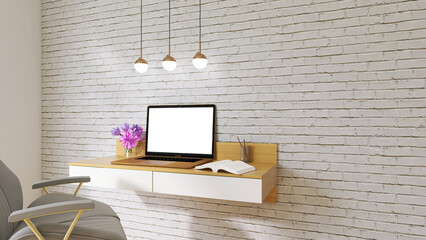 Mock-up office with laptop in white and wood colors. Brick wall, copy space.