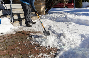 Removing ice on a walkway