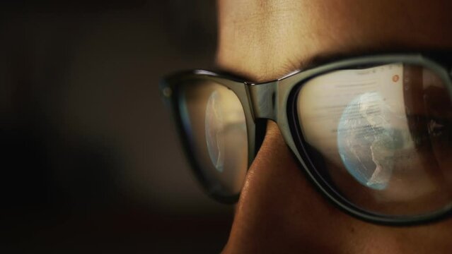 Cg footage with a part of a male face in glasses reflecting the Internet and a symbolic image of the globe. Digital technologies of the future.