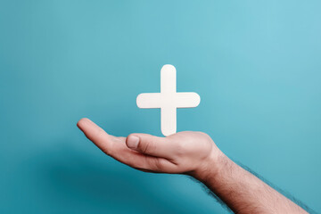 Obraz premium Hand Holding Cross, Symbol of Faith and Belief
