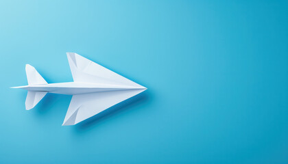 White Paper Airplane on Blue Background - obrazy, fototapety, plakaty
