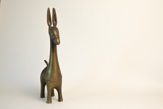 The donkey statue is made of brass