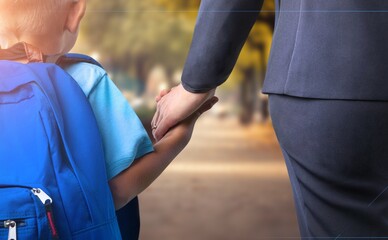 Child holding mother hand. Happy family