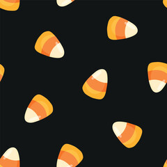 Fototapeta premium Seamless pattern with Halloween candy corn and black background