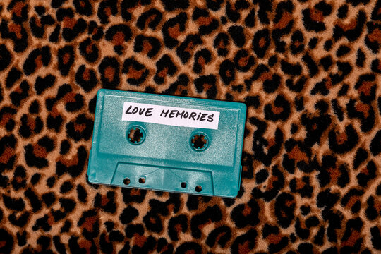 Retro blue cassette placed on a leopard surface