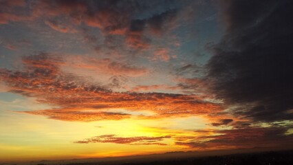 Naklejka na ściany i meble Sunset in the clouds over Curitiba, Brazil