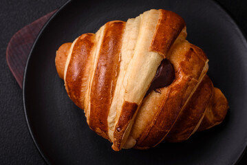 Delicious crispy sweet croissant cornet with chocolate