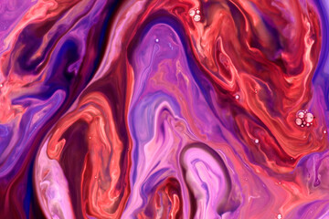 Swirling abstract pattern in vibrant purple and red hues