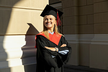 A young girl, a university graduate, in a robe.