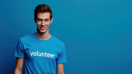 Volunteer in Blue T-Shirt Poses for Picture