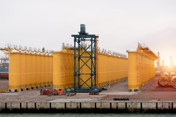 Obraz premium Offshore Wind Turbine Transition Pieces. Monopile Foundation. Wind Park Farm Construction Process. Renewable Energy Concept