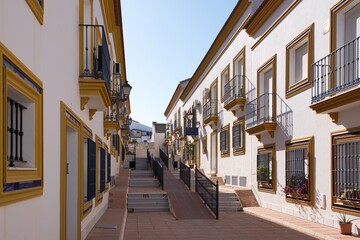 Fototapeta na wymiar a narrow street with a few buildings and a few stairs