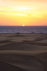 Obraz premium Asian Girl looking sunrise in Maspalomas. Spanish sunrise in Spain. Gran Canaria Sunrise and sunsets. 