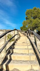 Wooden stairs in the mountain in the middle of trees, Teruel Spain