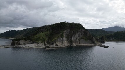 ocean shore with rocks and northern harsh nature