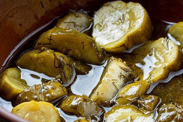 sliced dill pickles for hamburger top view. .Marinated  cucumbers with herbs and spices.