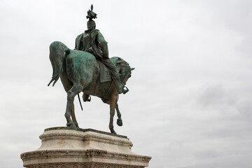 Fototapeta na wymiar Equestrian statue resting on a decorative marble base.