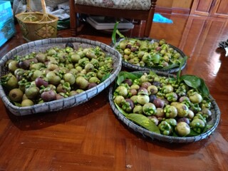 Mangosteen, a sweet, purple fruit from a Thai garden.