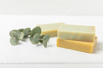 Soap on a texture background. Soap with eucalyptus extract and natural herbs on a white background. Beautiful Natural soap bars. Handmade organic soap concept. Skin care. banner