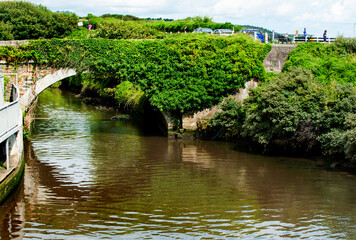 Stone bridge across Owenavorragh River in Courtown in Co Wexford, Ireland 