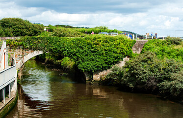 Stone bridge across Owenavorragh River in Courtown in Co Wexford, Ireland 