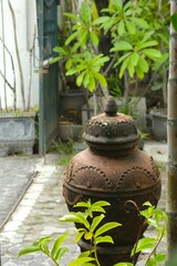 Gentong or barell of water for washing hand, in yard. Made from teracotta or clay. Gentong Air