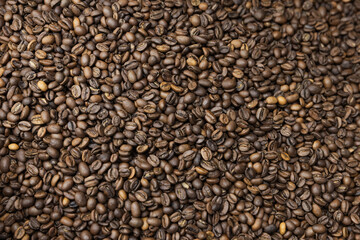 Roasted selective arabica coffee beans, background texture