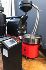 Coffee roaster with electronic control panel in a coffeehouse,