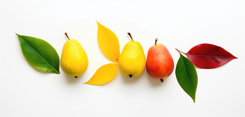 Three pears with colorful leaves arranged in a row on a white background.