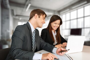 Two young business people in office workplace