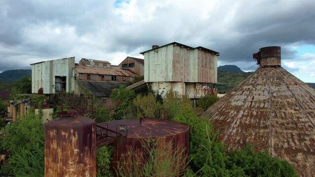 koloa sugar mill abandoned factory in kauai hawaii, aerial tilt